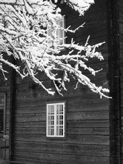 b&w picture of a snowy house scene